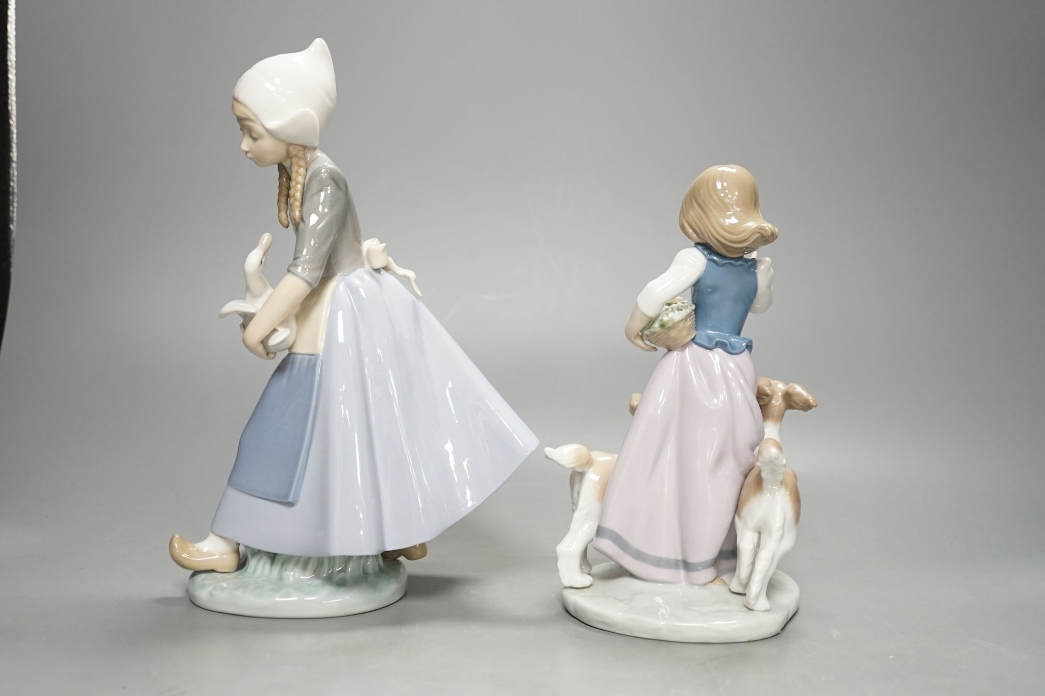 Two Lladro figure groups, tallest 26 cm